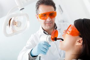 Dentist repairing a tooth