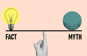 A hand points to a balance scale, with a lightbulb labeled "Fact" on the left and a textured circle labeled "Myth" on the right, against a beige background.