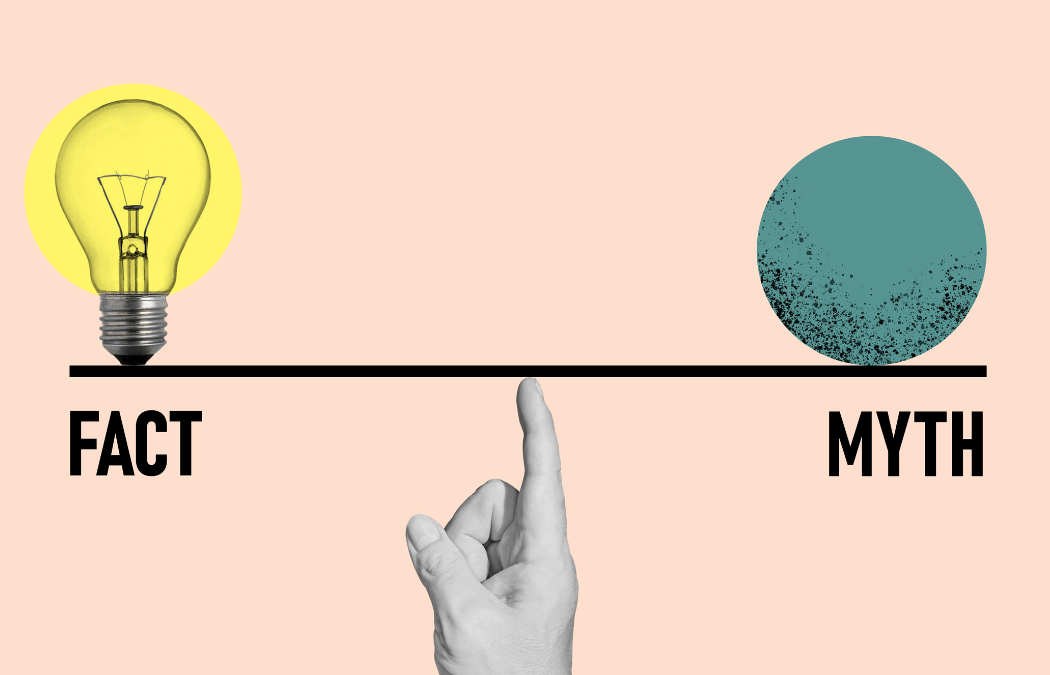 A hand points to a balance scale, with a lightbulb labeled "Fact" on the left and a textured circle labeled "Myth" on the right, against a beige background.